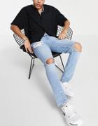 Asos Design Skinny Jeans With Heavy Rips And Raw Hem In Light Wash Blue-blues