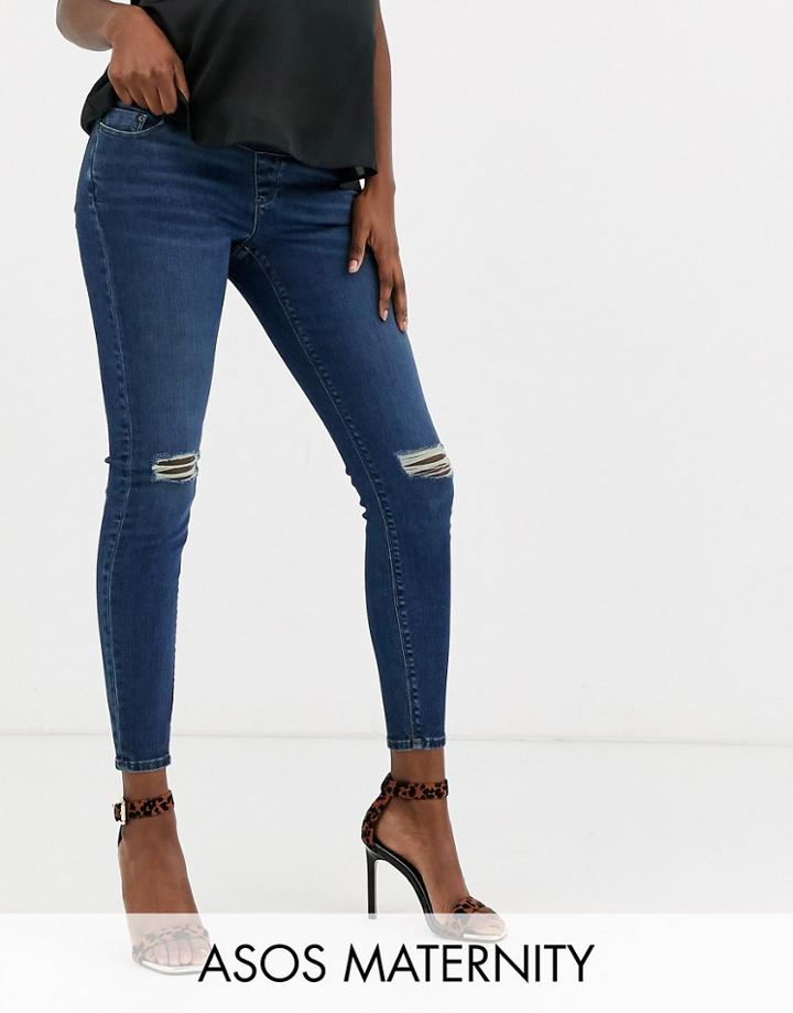 Asos Design Maternity Ridley High Waisted Skinny Jeans In Dark Stonewash Blue With Busted Knee With Under The Bump Waist - Blue