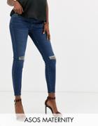 Asos Design Maternity Ridley High Waisted Skinny Jeans In Dark Stonewash Blue With Busted Knee With Under The Bump Waist - Blue