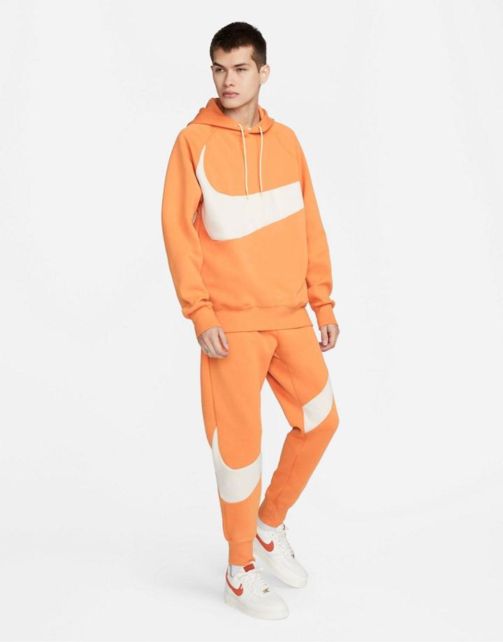 Nike Swoosh Pack Tech Fleece Cuffed Sweatpants In Orange-brown