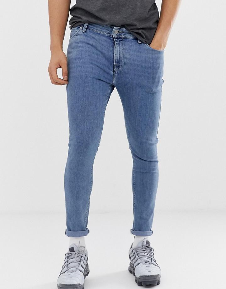 Asos Design Spray On Jeans In Power Stretch Denim In Light Wash Blue - Blue