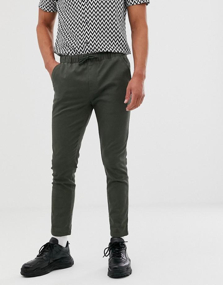 Asos Design Skinny Chinos With Elastic Waist In Dark Khaki - Green