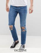 Mennace Relaxed Skinny Cropped Jeans With Rips And Raw Hem In Mid Wash - Blue
