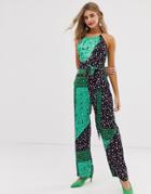 Liquorish Halter Neck Jumpsuit With Tie Waist Detail In Mixed Blue Print - Multi