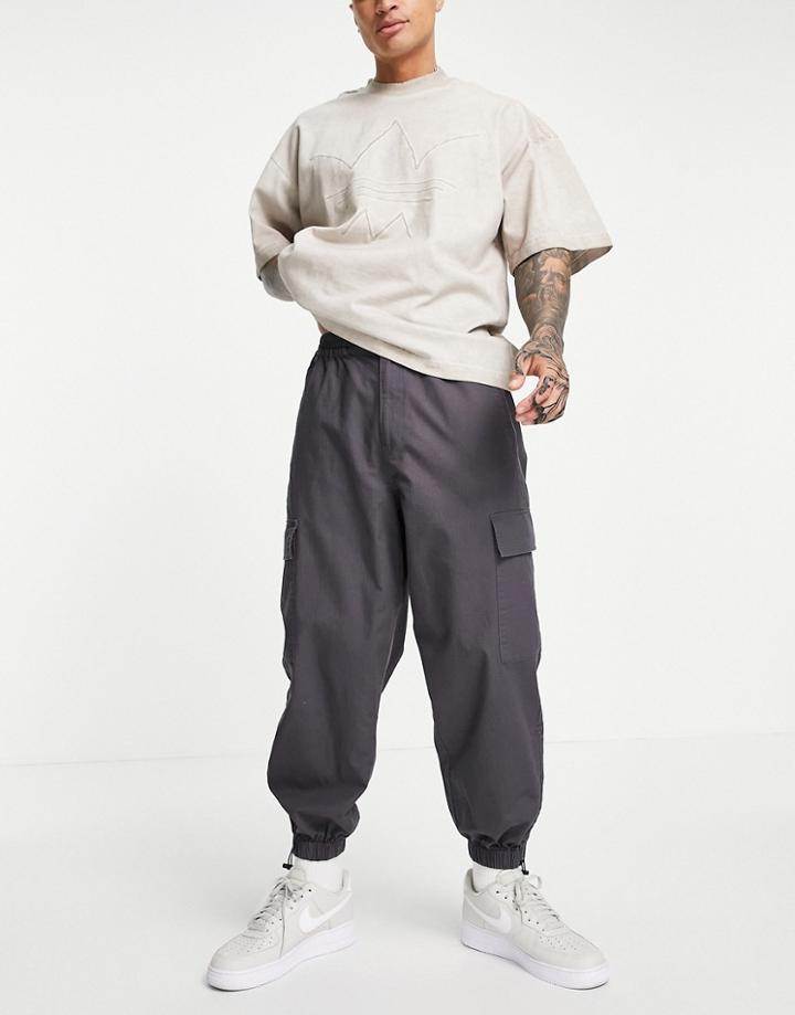 Asos Design Oversized Tapered Cargo Pants With Toggle Hem In Gray-grey