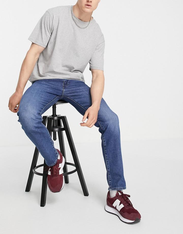 Levi's 502 Tapered Fit Jeans In Mid Wash Blue-blues