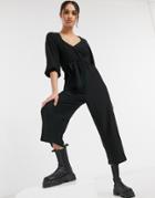 Asos Design Wrap Front Textured Smock Jumpsuit In Black