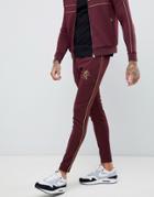 Gym King Skinny Joggers In Burgundy With Gold Side Stripes - Red