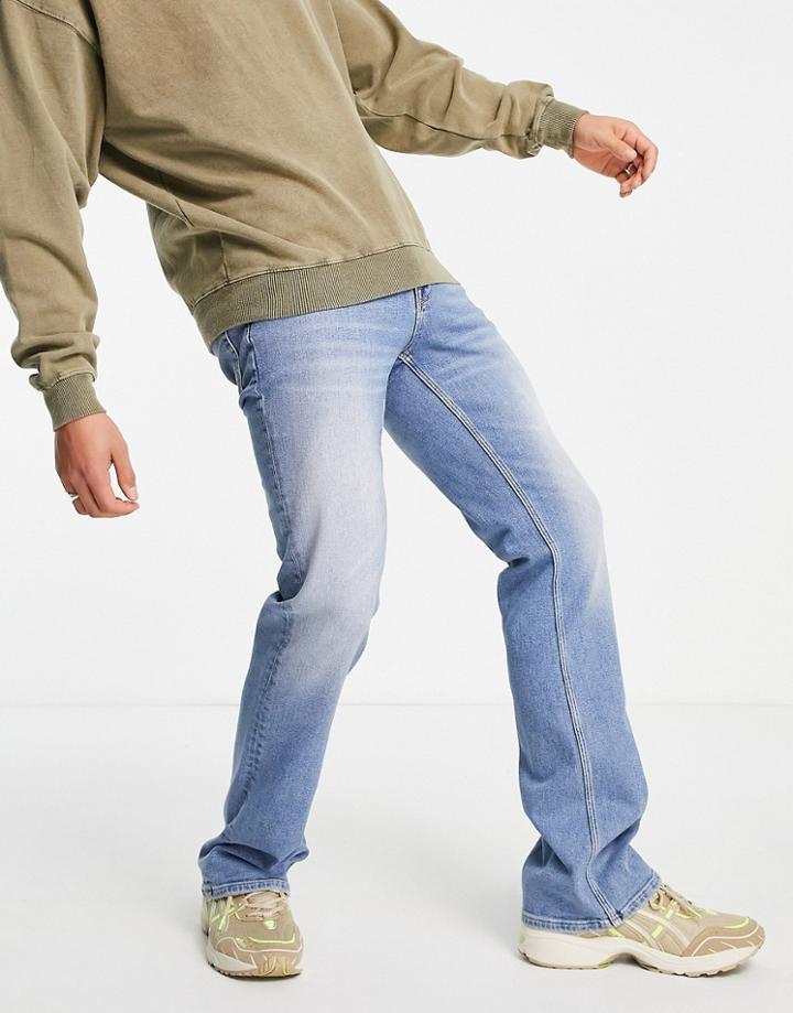 Asos Design Flared Jeans In Mid Wash Blue-blues