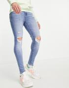 Asos Design Spray On Jeans With Power Stretch In Mid Wash Blue With Knee Rips And Abrasions-blues