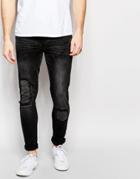 Asos Super Skinny Jeans Rip With Patches In Washed Black - Black