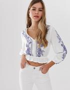 Parisian Cropped Wrap Front Embroidered Blouse With Peplum Hem - White