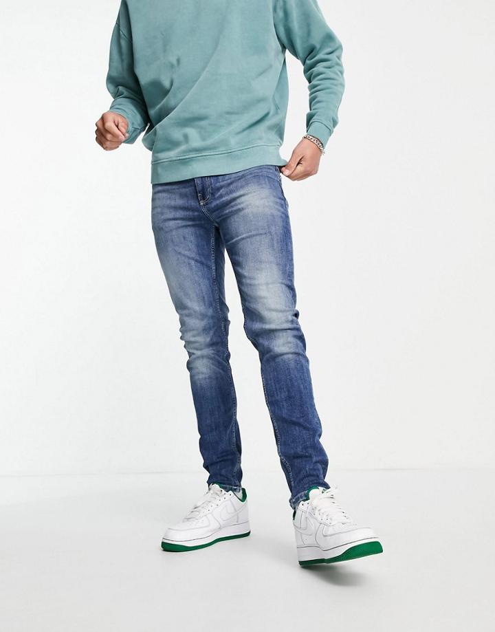 Asos Design Organic Cotton Blend Skinny Jeans In Mid Wash Blue-blues