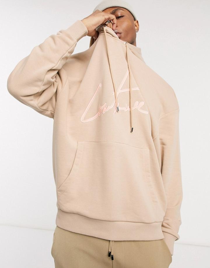 The Couture Club Oversized Applique Signature Hoodie Front And Hood Logo In Beige-neutral