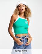 Reclaimed Vintage Inspired Shrunken Rib Tipped Tank Top With Crest Embroidery In Green
