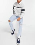 Asos Design Slim Jeans In Light Wash Blue With Abrasions And Raw Hem-blues