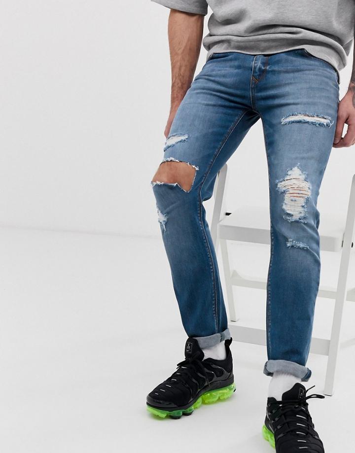 Asos Design Skinny Jeans In Mid Wash Blue With Heavy Rips
