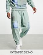 Asos Unrvlld Spply Oversized Sweatpants With Abstract Graphic & Logo Prints In Light Green - Part Of A Set