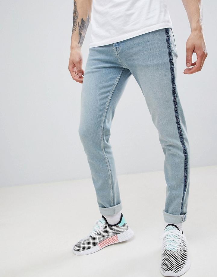 Asos Design Skinny Jeans In Light Wash Blue With Geo-tribal Taping - Blue