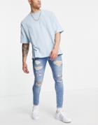 Asos Design Spray On Jeans With Power Stretch In Vintage Light Wash With Heavy Rips-blues