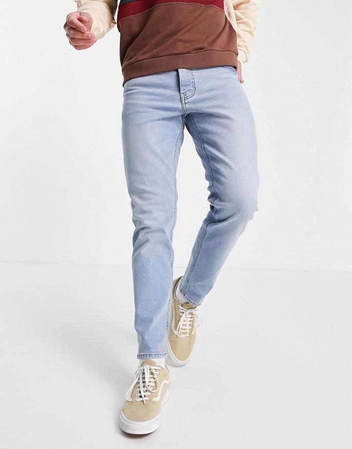 Asos Design Stretch Tapered Jeans In Light Wash-blues