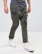 Asos Drop Crotch Pants With Badges And Strapped Hems - Green