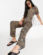 Asos Design Tie Back Puff Sleeve Flare Leg Jumpsuit In Lilac Floral-multi