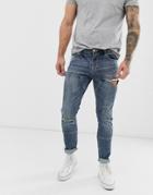 Asos Design Skinny Jeans With Cut And Sew Panels And Rips In Dark Wash Blue