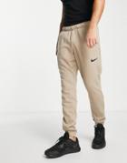 Nike Training Dri-fit Swoosh Cuffed Fleece Sweatpants In Dark Sand-white