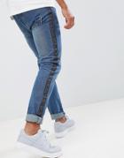 Boohooman Skinny Jeans With Geo-tribal Side Stripe In Mid Blue Wash - Blue