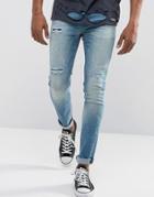 Asos Super Skinny Jeans In Vintage Mid Wash Blue With Rip And Repair Detail - Blue