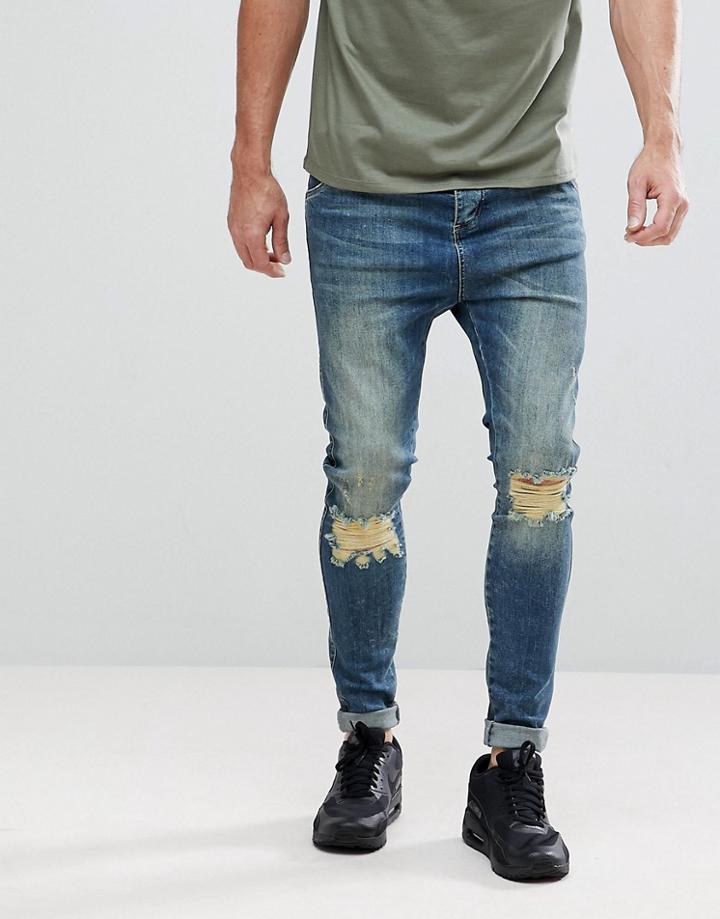 Siksilk Muscle Fit Drop Crotch Jeans With Knee Rips - Blue