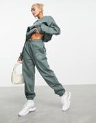 Asos Weekend Collective Oversized Sweatpants With Arch Logo In Khaki-green