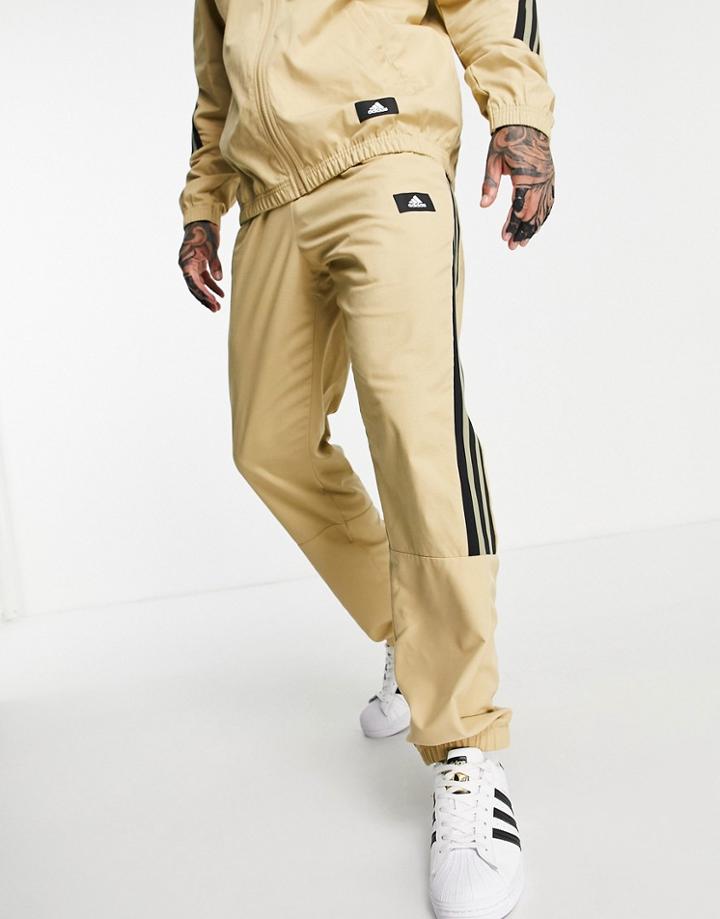 Adidas Woven Sweatpants With Three Stripes In Beige-brown