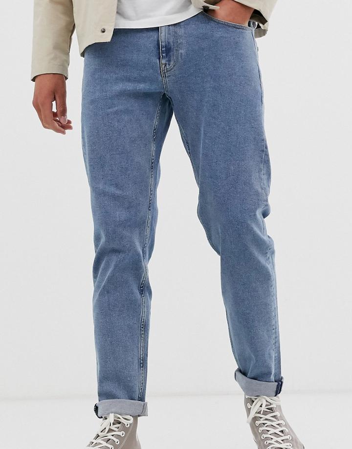Asos Design Tapered Jeans In Flat Mid Wash Blue - Blue