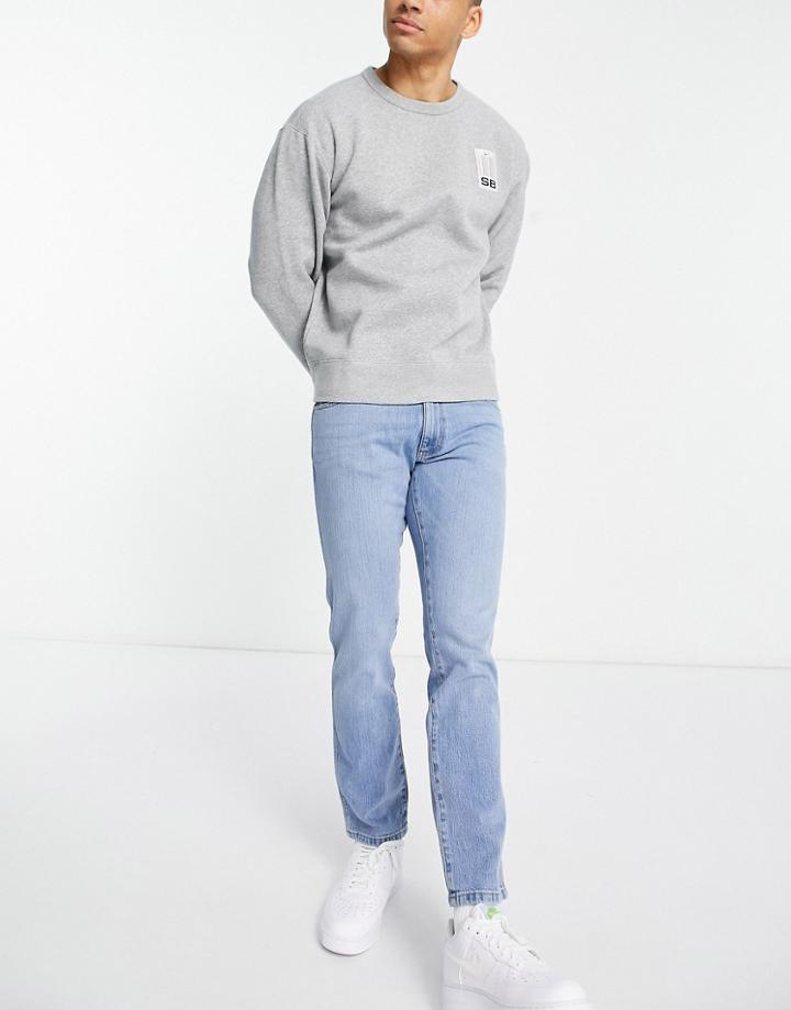 Wrangler Larston Slim Tapered Fit Jeans In Mid Blue-blues