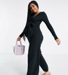 In The Style X Dani Dyer Ribbed Button Through Jumpsuit With Belt In Black
