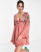 Asos Design Textured Wrap Mini Skater Dress With Ruffles And Floral Embroidery In Peach-orange