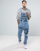 Asos Denim Overalls In Washed Mid Blue With Text Print - Blue