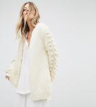 Oneon Hand Knitted Reversible Cardigan With Pom Pom Sleeves - Cream