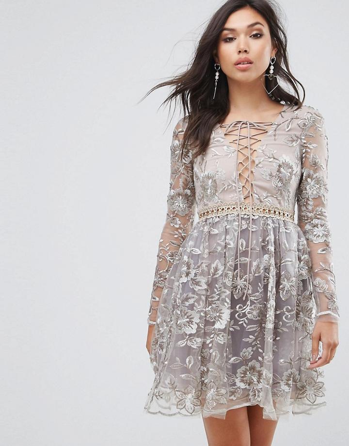 True Decadence All Over Embroidered Mini Skater Dress With Lace Up Plunge Front - Gold