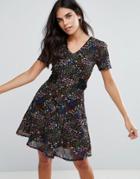 Yumi Tea Dress In Mini Ditsy Print - Black