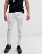 Asos Design Spray On Jeans In Power Stretch With Heavy Rips In White - White
