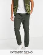 Asos Design Skinny Chinos With Pin Tuck And Elastic Waist In Dark Green