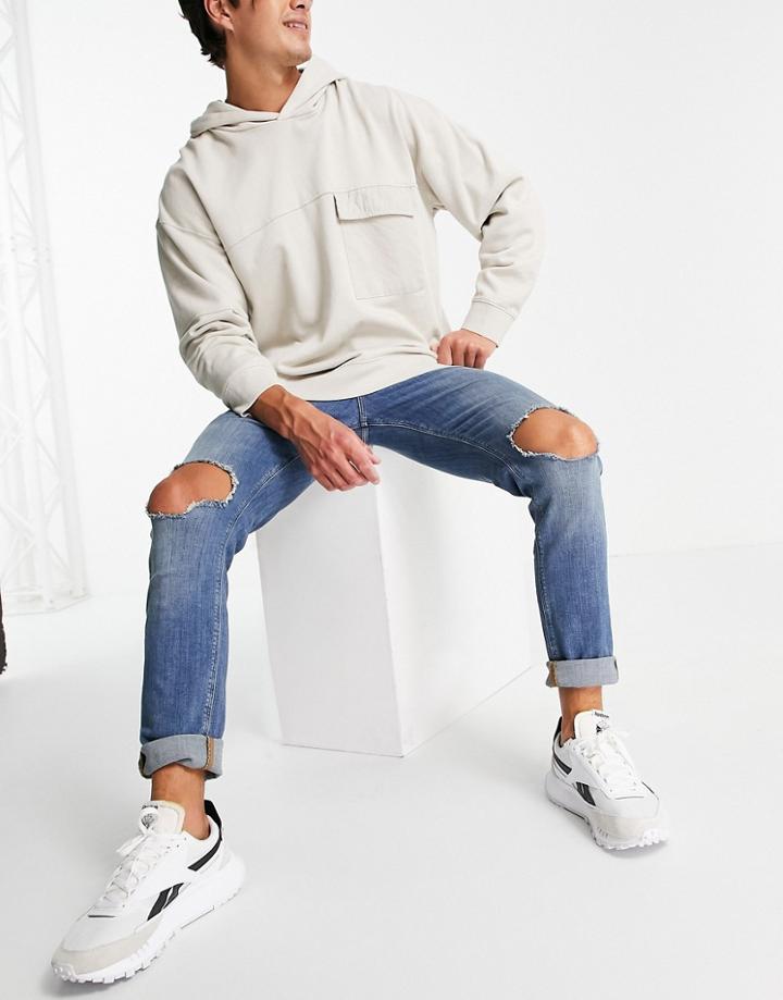 Asos Design Skinny Jeans In Tinted Mid Wash With Knee Rips-blues