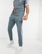 Adidas Originals Superstar Track Sweatpants In Blue Oxide-blues