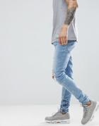 Criminal Damage Skinny Jeans In Lightwash Blue With Distressing - Blue