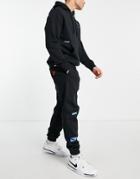 Nike Sport Essentials Multi Futura Logo Fleece Sweatpants In Black