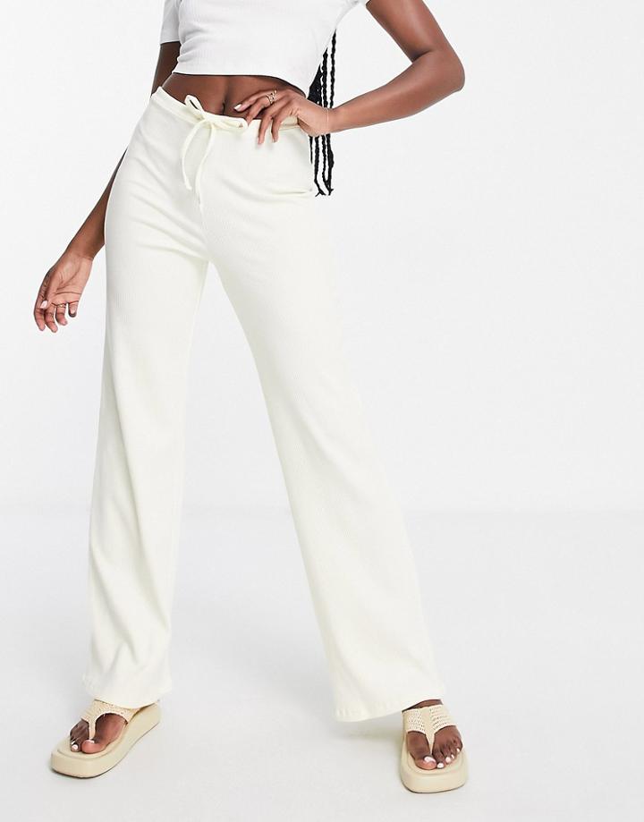 Asos Design Rib Pants With Puddle Hem In Yellow