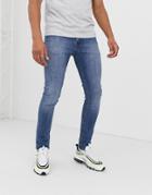 Asos Design Super Skinny Jeans In Classic Mid Wash Blue